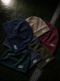The Skully Style II beanie colour range — Stone, Gray, Blue and Khaki with left-side SI logo